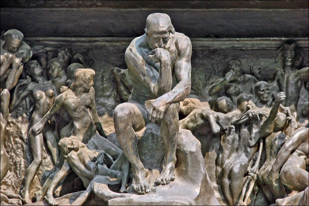 The Thinker in Auguste Rodin's sculpture The Gates of Hell. Image Credit: Wikipedia